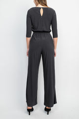 Emma & Michele Boat Neck Keyhole Front 3/4 Sleeve Tie Waist Blouson Keyhole Back Jersey Jumpsuit by Curated Brands