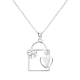 Metal Cut Out Ribbon Heart Lock Pendant Necklace by Madeline Love