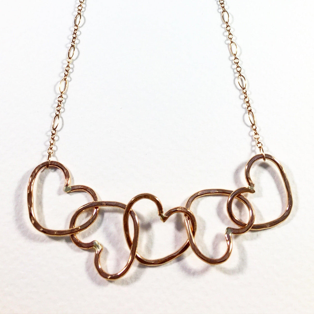 Five Hearts Linked Necklace by Jennifer Cervelli Jewelry