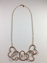 Five Hearts Linked Necklace by Jennifer Cervelli Jewelry