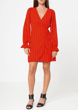 Smocked Bell Sleeve Wrap Dress in Red by Shop at Konus